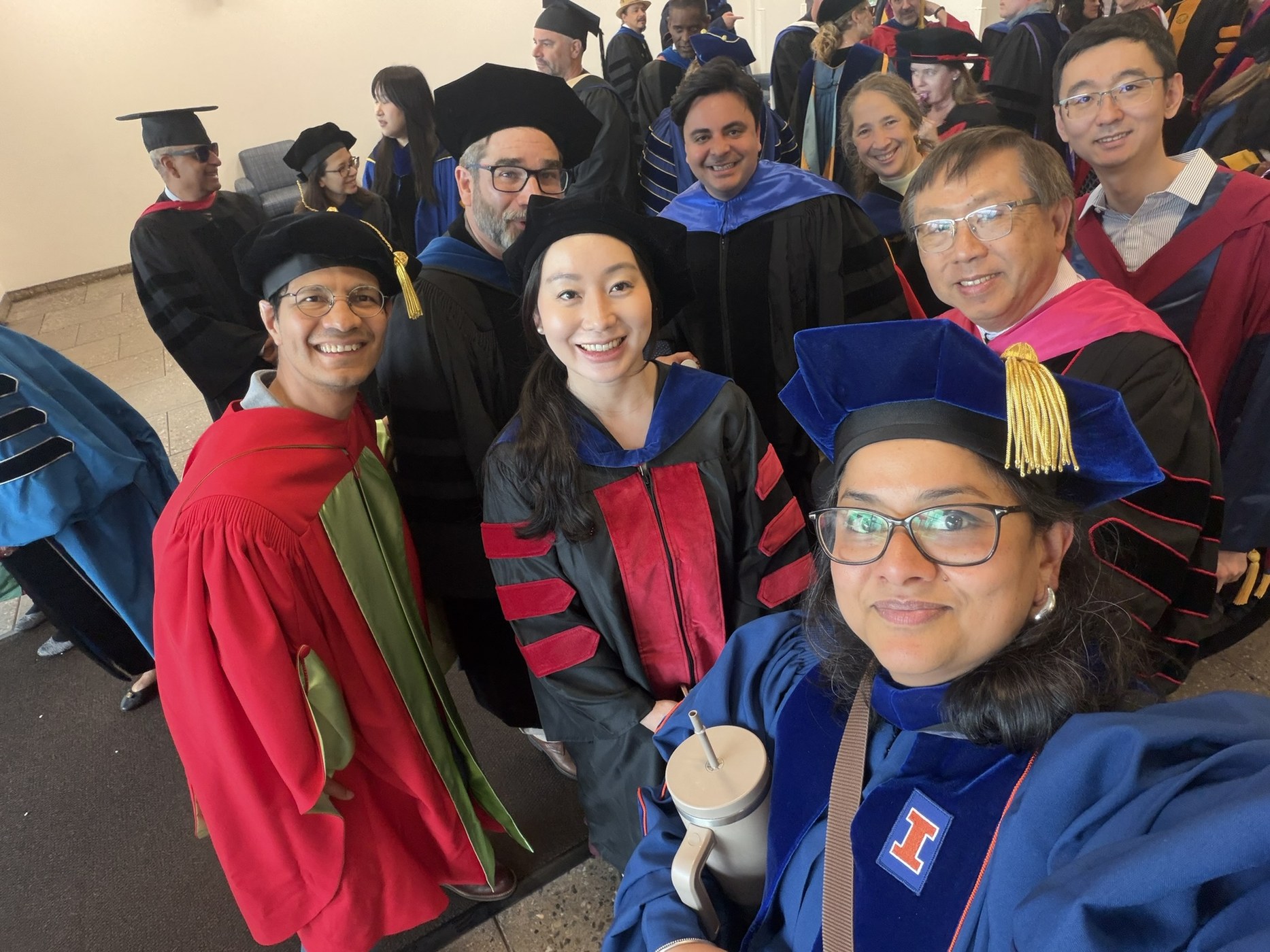 Dr. Sowmya Balachandran with academic colleagues at a university graduation ceremony